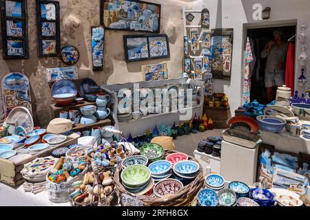 Oia, Santorini, Greece - July 3, 2021: Souvenir shop display for tourists in Oia, Santorini  Island, Greece. Stock Photo