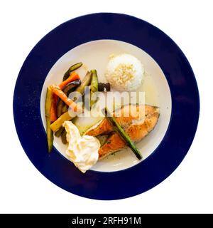 Nice serving of seared salmon with rice and vegetables on side Stock Photo