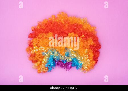 Funny Party concept Rainbow Clown Wig Fluffy Synthetic Cosplay Anime Fancy Wigs Festive Purim Stock Photo