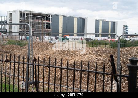 Slough, Berkshire, UK. 3rd August, 2023. Following the sale of the former Akzo Nobel Decorative paint manufacturing site in Wexham Road, Slough, an Enabling Works Planning Application by American Data Centre Company, Equinix, Inc has been submitted to Slough Borough Council. The Enabling Works Application includes the demolition of the remaining buildings on the site including the former Akzo Nobel Research & Development buildings (pictured). A long row of mature tall conifer trees on the site that run parallel with Wexham Road have recently been felled. The tree wood chippings are piled up on Stock Photo