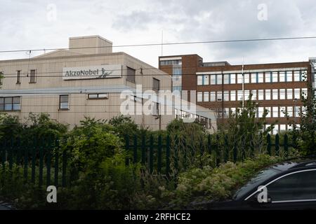 Slough, Berkshire, UK. 3rd August, 2023. Following the sale of the former Akzo Nobel Decorative paint manufacturing site in Wexham Road, Slough, an Enabling Works Planning Application by American Data Centre Company, Equinix, Inc has been submitted to Slough Borough Council. The Enabling Works Application includes the demolition of the remaining buildings on the site including the former Akzo Nobel Research & Development buildings (pictured). A long row of mature tall conifer trees on the site that run parallel with Wexham Road have recently been felled. The tree wood chippings are piled up on Stock Photo