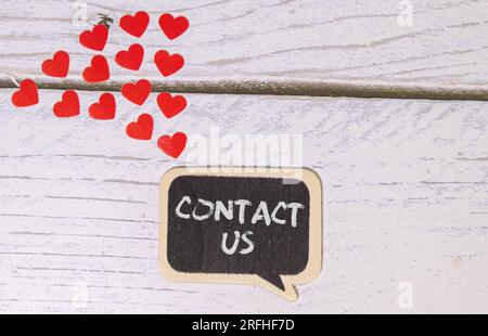 A 'contact us' message on keyboard, internet or online contact through website. Stock Photo