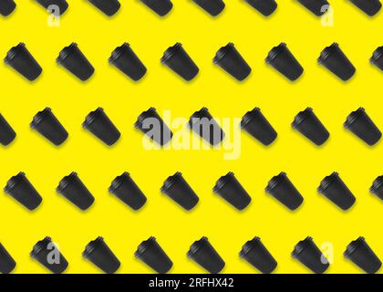To-go drink. Pattern design with paper coffee cup on yellow background Stock Photo