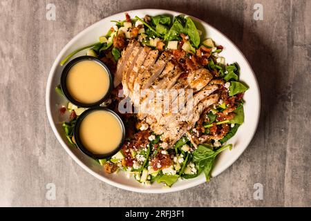 Spinach salad with grilled chicken and bacon Stock Photo