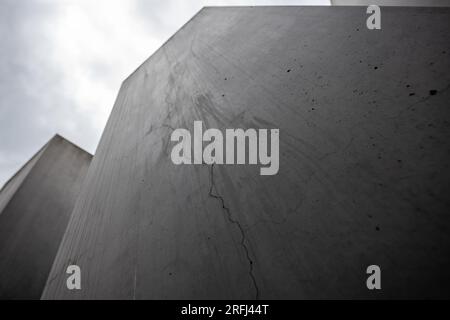 Berlin, Germany. 03rd Aug, 2023. View of a stele with a crack in the concrete. Many of the more than 2700 concrete stelae of the Holocaust Memorial near the Brandenburg Gate show cracks. Credit: Hannes P. Albert/dpa/Alamy Live News Stock Photo