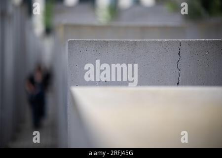 Berlin, Germany. 03rd Aug, 2023. View of a stele with a crack in the concrete. Many of the more than 2700 concrete stelae of the Holocaust Memorial near the Brandenburg Gate show cracks. Credit: Hannes P. Albert/dpa/Alamy Live News Stock Photo