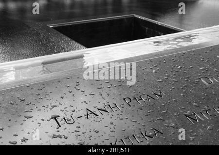 Black & white closeup photos of a name of a victim at the 9/11 terrorist attacks at the Sept. 11 9/11 memorial site Stock Photo