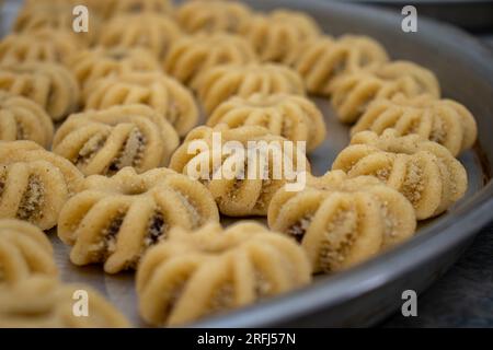Process of making arabic cookies and kahk for islamic eid after ramadan Stock Photo