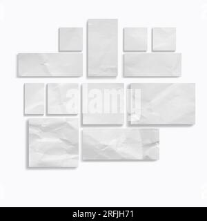 Blank sheets of crumpled and torn paper of different shapes on a white background with copy space Stock Photo