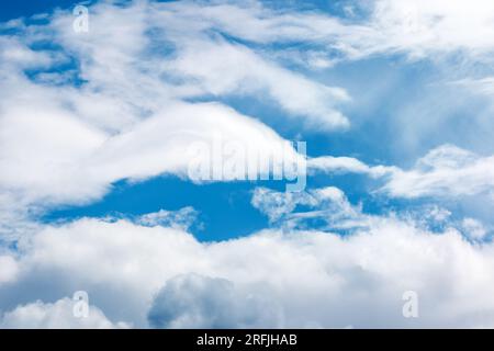 Sun rays on cirrus clouds, bue sky. Stock Photo