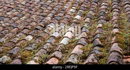 red old ceramic roof tile ancient background texture moss covered roofing tile vintage corrugated tiles element seamless pattern Stock Photo