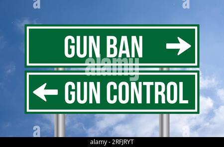 Gun ban or gun control road sign on blue sky background Stock Photo