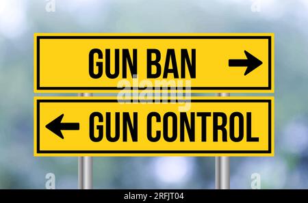 Gun ban or gun control road sign on blur background Stock Photo