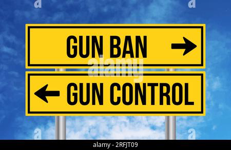 Gun ban or gun control road sign on blue sky background Stock Photo