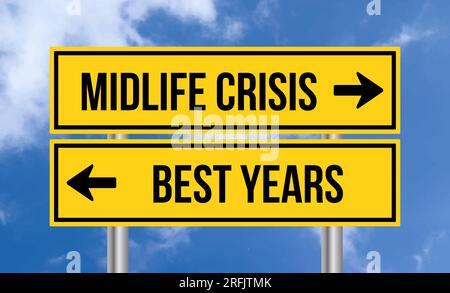 Midlife crisis or best years road sign on blue sky background Stock Photo