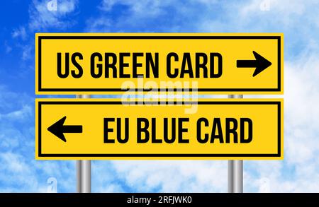 Us green card or eu blue card road sign on blue sky background Stock Photo