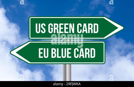 Us green card or eu blue card road sign on blue sky background Stock Photo