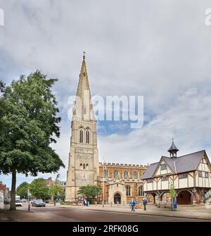 Christian church of St Dionysius and the old grammar school in the Square at Market Harborough, England. Stock Photo