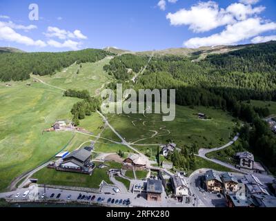 Livigno village ski and Bikepark valley in Valtellina, Lombardia, Italy Aerial view Drone panoramic view. Stock Photo