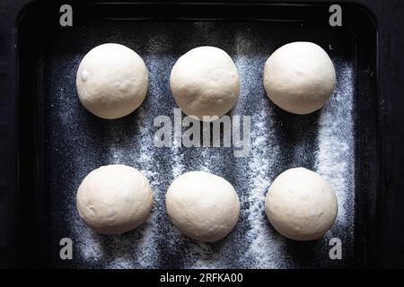 Dough balls are resting and waiting to be turned into pizza Stock Photo