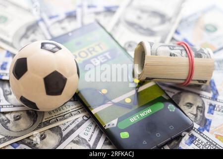 Watch a live sports event on your mobile device. Betting on football matches Stock Photo