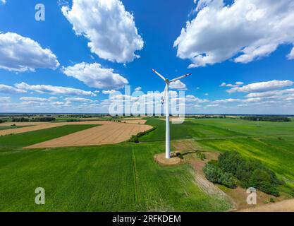 Aerial drone view of wind power turbines, part of a wind farm. W Stock Photo