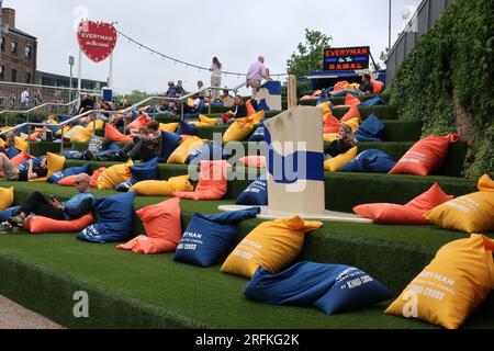 Everyman screen on the banks of the Regent's Canal in Kings Cross showed open air cinema screenings with tiered seating & comfy beanbags; summer 2023. Stock Photo