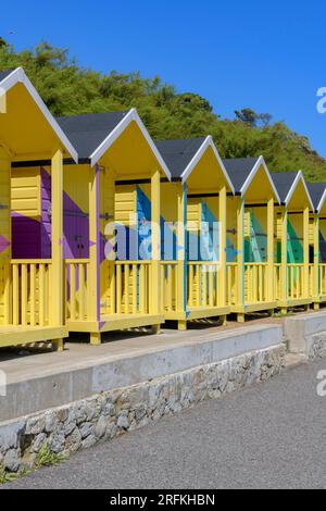 Recoloured beach huts called No.1054 Arpeggio by artist Rana Begum are part of the Folkestone Triennial 2021 along the seafront in Folkestone, UK. Stock Photo
