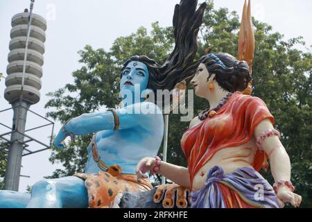 Giant statue of Lord Shiva and Parvati at Triveni Ghat, Rishikesh, with Lord Shiva sitting on the back of a tiger and Goddess Ganga. Stock Photo