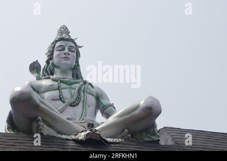 Hindu Adiyogi Shiva statue. Huge statue of Lord Shiva at the entrance of Triveni Ghat, Rishikesh. Shiva in the posture of yoga while meditating. Stock Photo