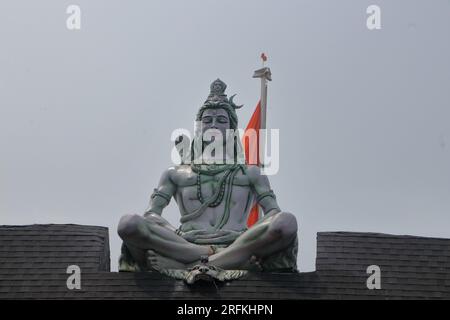 Hindu Adiyogi Shiva statue. Huge statue of Lord Shiva at the entrance of Triveni Ghat, Rishikesh. Shiva in the posture of yoga while meditating. Stock Photo
