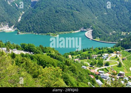 View of Lago di Cadore lake and Pieve di Cadore dam and the village of Sottocastello in Veneto region and Belluno province in Italy Stock Photo