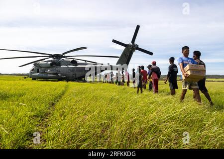 Basco, Philippines. 03rd Aug, 2023. Filipino volunteers help unload emergency relief supplies from a U.S. Marine Corp CH-53E Super Stallion helicopter in the aftermath of Typhoon Egay, August 3, 2023 on Fuga Island, Philippines. The category 4 hurricane sweep across part of the Philippines with 140 mph winds killing at least 26 people and causing widespread damage. Credit: Cpl. Sean Potter/US Army/Alamy Live News Stock Photo