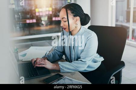 Woman in office on laptop, research and sticky note ideas on moodboard for business plan, brainstorming or proposal process. Thinking, typing pitch Stock Photo