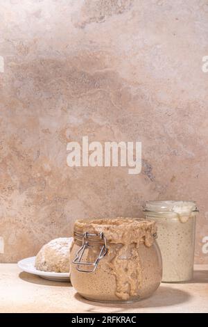 Healthy lifestyle, gluten free fermenting diet. Homemade sourdough. Active bubbly rye, wheat, oat sourdough with different flour and fermentation meth Stock Photo