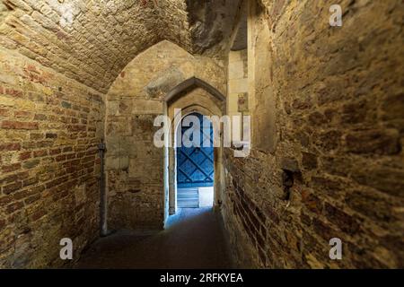 London, England, UK - July 16, 2022.The Tower of London interior, inside the historic castle, palace with medieval wood doors and old stone corridors. Stock Photo