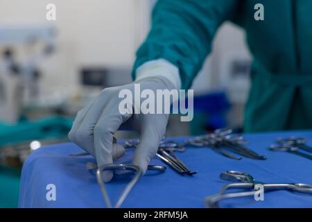 Close up of african american male surgeon preparing surgical instruments in operating theatre Stock Photo