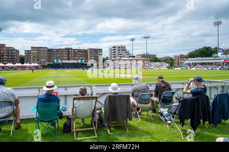 Hove UK 4th August 2023 - Spectators enjoy the sunshine as they watch Sussex Sharks take on Durham  during the Metro Bank One Day Cup cricket match at the 1st Central County Ground in Hove : Credit Simon Dack /TPI/ Alamy Live News Stock Photo