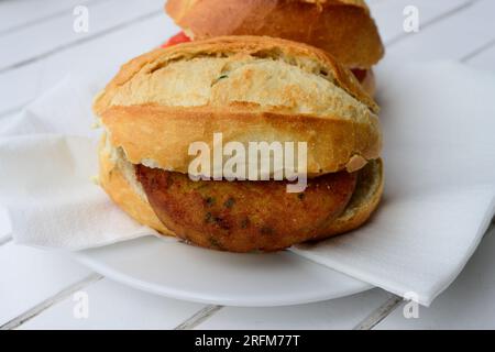 Fish Cake Sandwich or Bun Fischbroetchen mit Fischfrikadelle in Hamburg, Germany Stock Photo