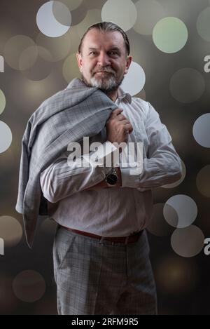 An old man wear bright clothes Stock Photo