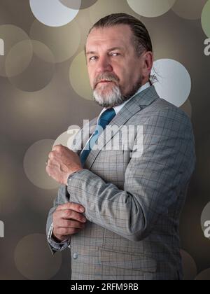 An old man wear bright clothes Stock Photo