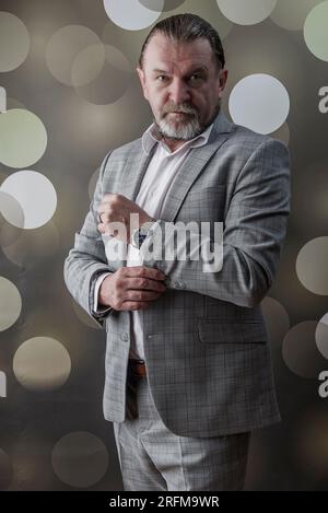 An old man wear bright clothes Stock Photo