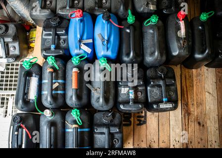 Plastic containers containing chemical waste from laboratories, waste management concept Stock Photo