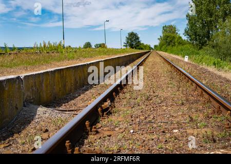 Abandoned railway station with rails in Hungary Stock Photo