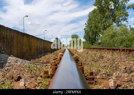 Abandoned railway station with rails in Hungary Stock Photo