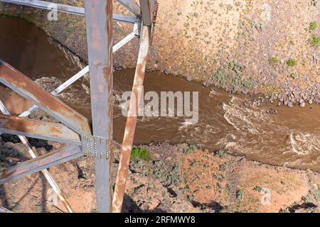Details of bolted gusset plate on Rio Grande Gorge Bridge over flowing Rio Grande river below.  Fifth highest bridge, constructed in 1965 Stock Photo