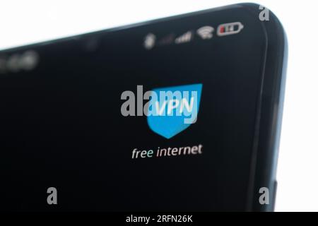 uses VPN application on smartphone. Virtual private network, anonymous, safe and secure internet access on mobile phone. Desktop banner, technology ba Stock Photo