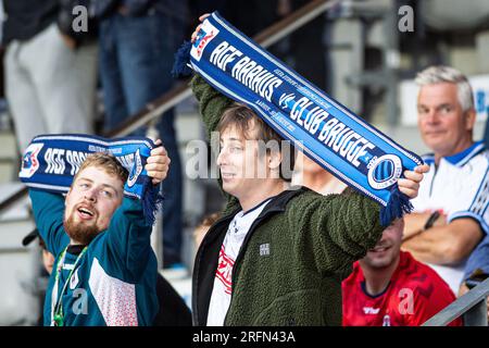 Club Brugge fans in the stands celebrate the result after the