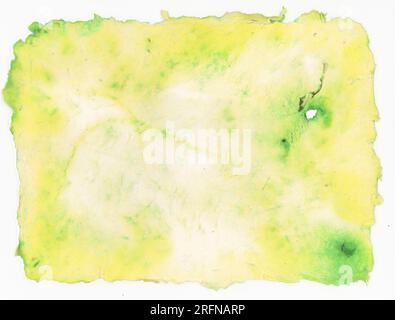 Yellow-green and white rough handmade paper with a frayed edge and a hole. Horizontal background Stock Photo