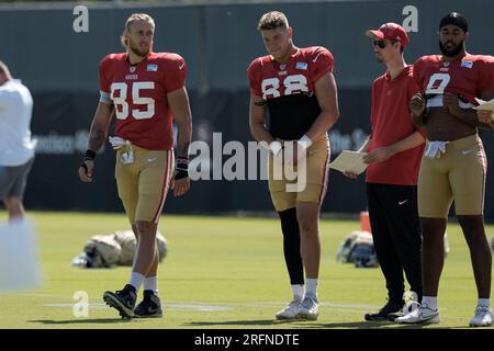 San Francisco 49ers tight ends Vance McDonald (89) and Garrett Celek (88)  take a knee following guard, Mike Iupati's (77) game ending injury during  the NFC Championship Game against the Seattle Seahawks